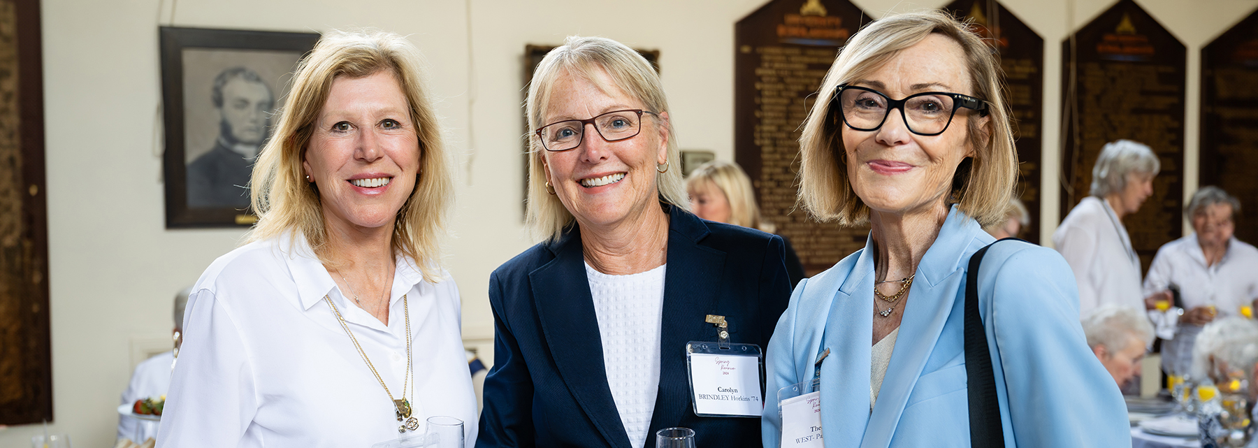 Three BSS alumnae smiling at their yearly meet up during alumnae week.